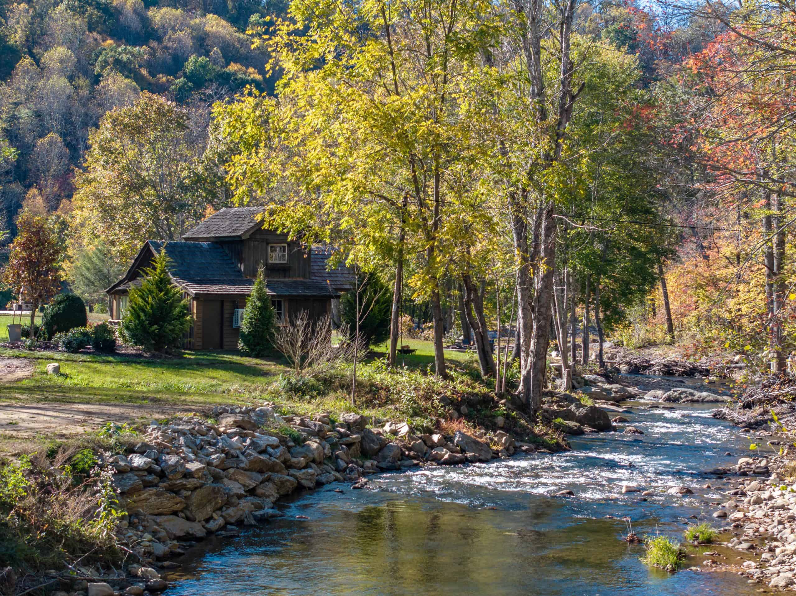 Luxury mountain estate riverside cottage with lush landscape restoration along trout river, Ahma at Cold Mountain, Canton North Carolina