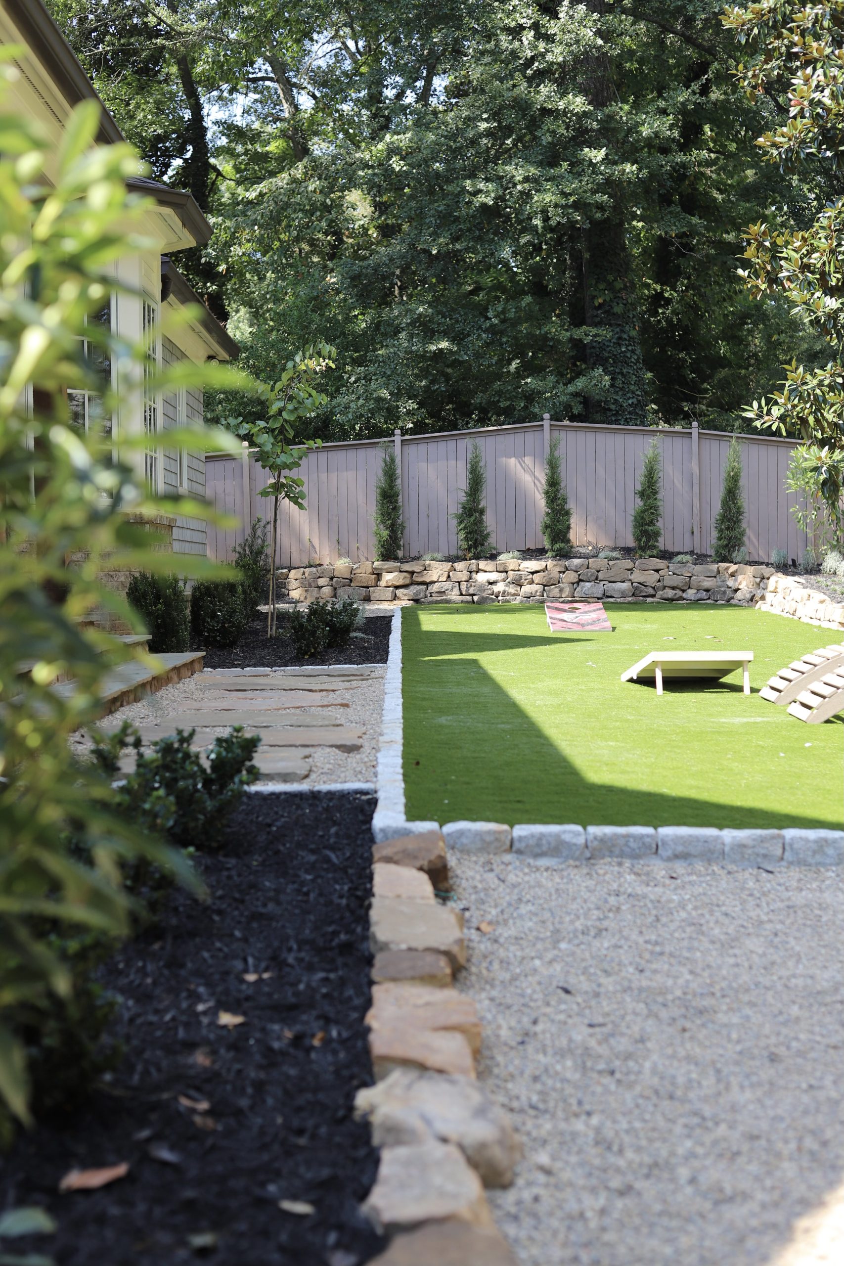 Full landscape overview of the Woods Residence backyard redesign near Chastain Park, Atlanta by Garden Atlantic