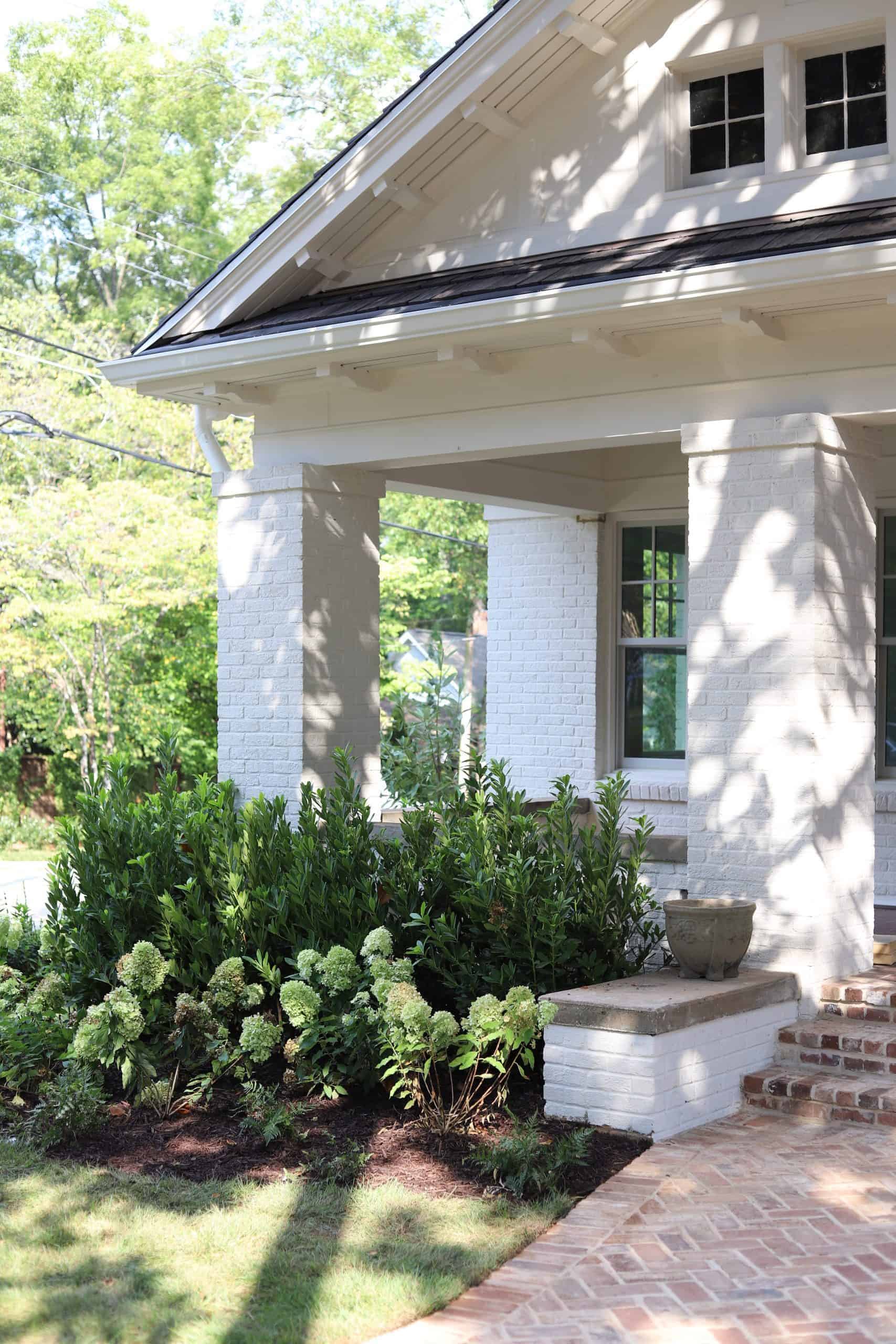 Front entry planting with limelight hydrangeas and herringbone brick walkway at Highland & Morningside, Virginia-Highland, Atlanta by Garden Atlantic
