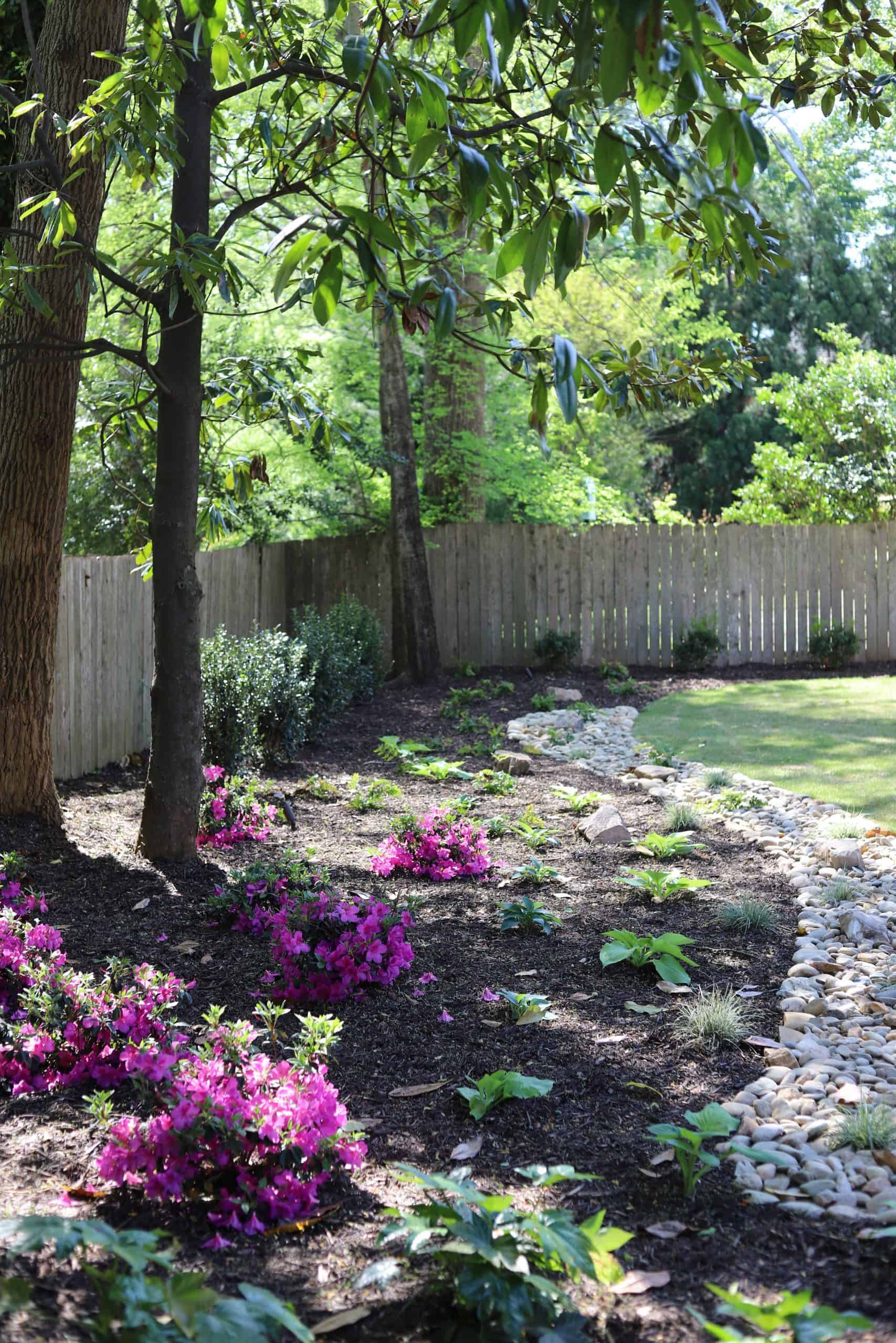 Garden path with blooming azaleas, river rock edging, and timber pergola at the Healy Project, Chastain Park, Atlanta by Garden Atlantic
